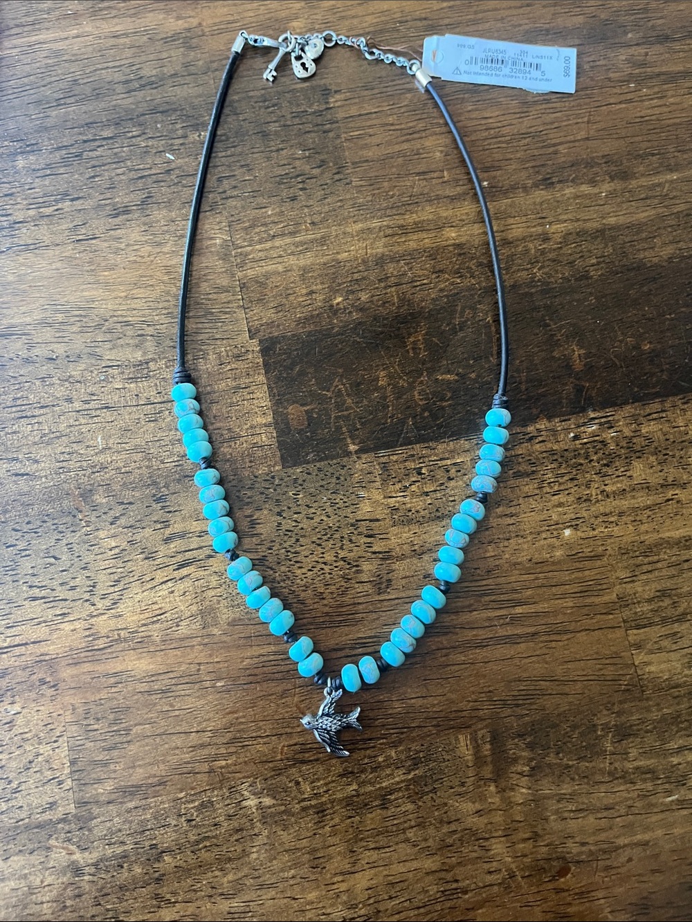 Fossil Turquoise Bead Necklace with Silver Bird Charm
